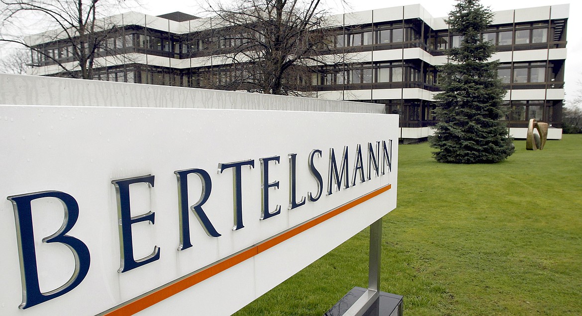 FILE - An outside view of the German media giant Bertelsmann in Guetersloh, Germany, is shown March 13, 2003. The government and publishing titan Penguin Random House, owned by Bertelsmann, are set to exchange opening salvos in a federal antitrust trial Monday, Aug. 1, 2022, as the U.S. seeks to block the biggest U.S. book publisher from absorbing rival Simon & Schuster. (AP Photo/Michael Sohn, File)