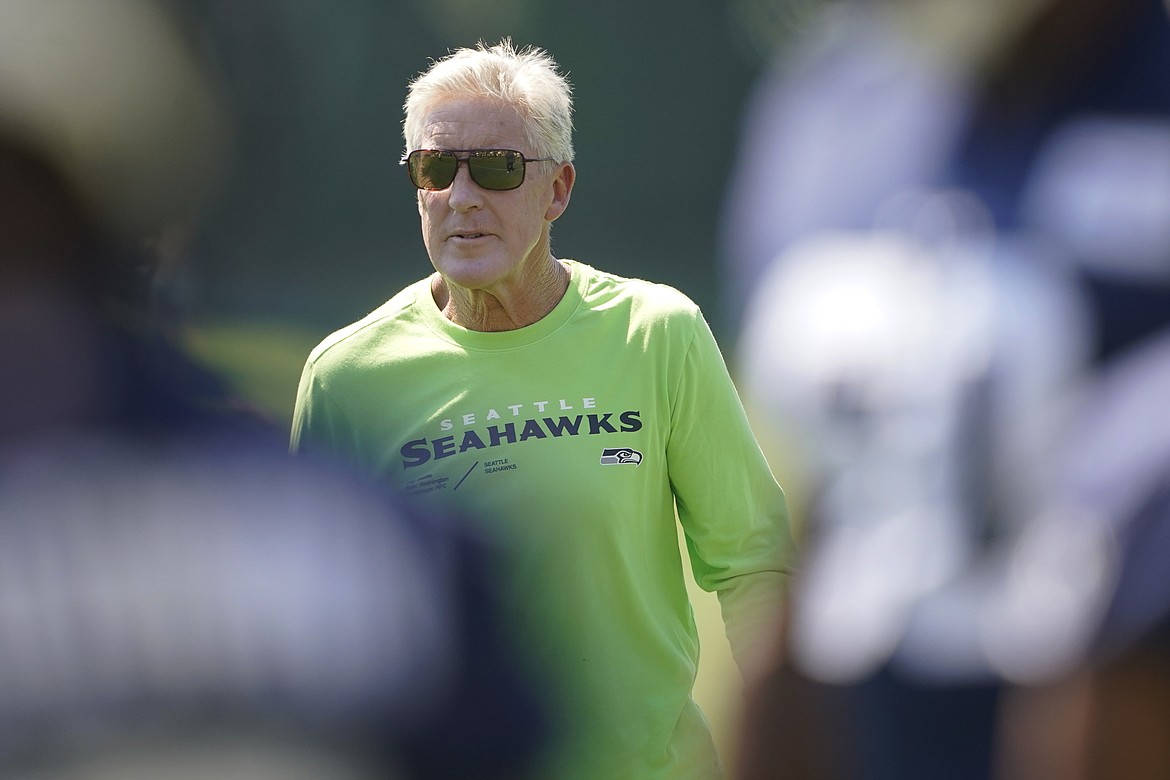 Seattle Seahawks head coach Pete Carroll watches NFL football practice Saturday, July 30, 2022, in Renton, Wash.