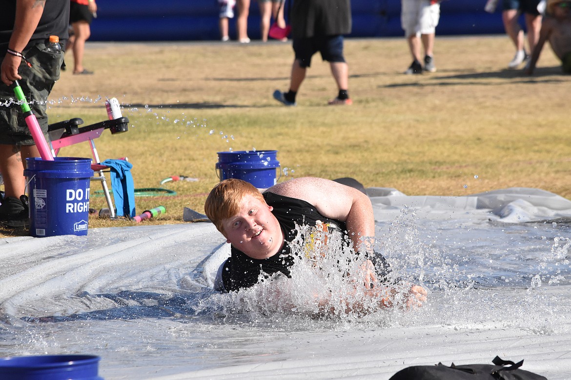 Shedders beat the heat by utilizing one of the many water activities provided by the festival including a Slip ‘N Slide.