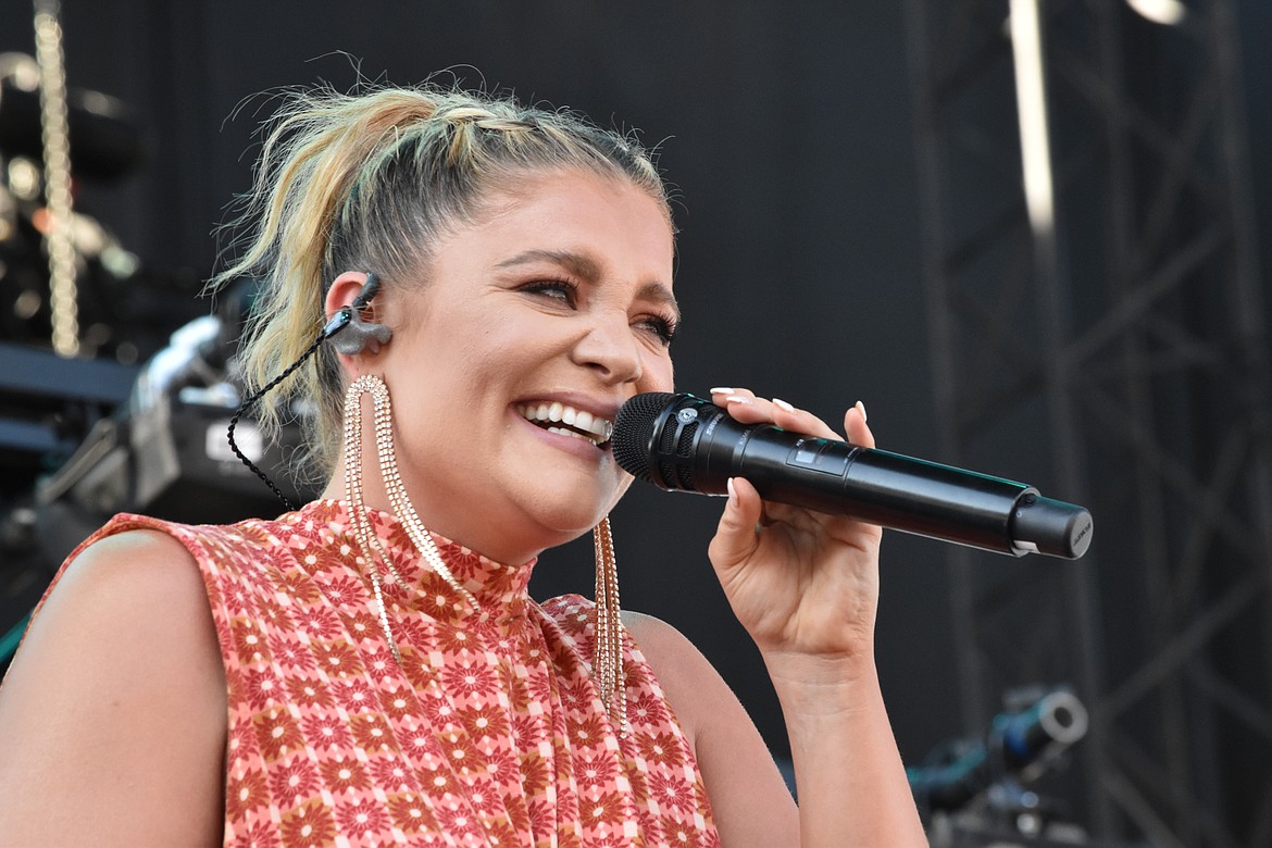 Lauren Alaina smiles as she performs. Alaina is a singer-songwriter and was the runner-up on the tenth season of American Idol.