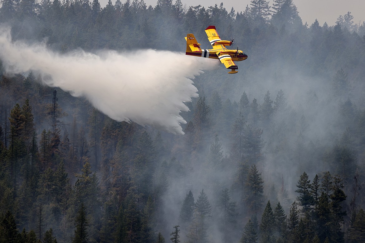 A Bridger Aerospace CL-415EAF super scooper drops water on the Elmo Fire near Black Lake Monday, Aug. 1. (Jeremy Weber/Daily Inter Lake)