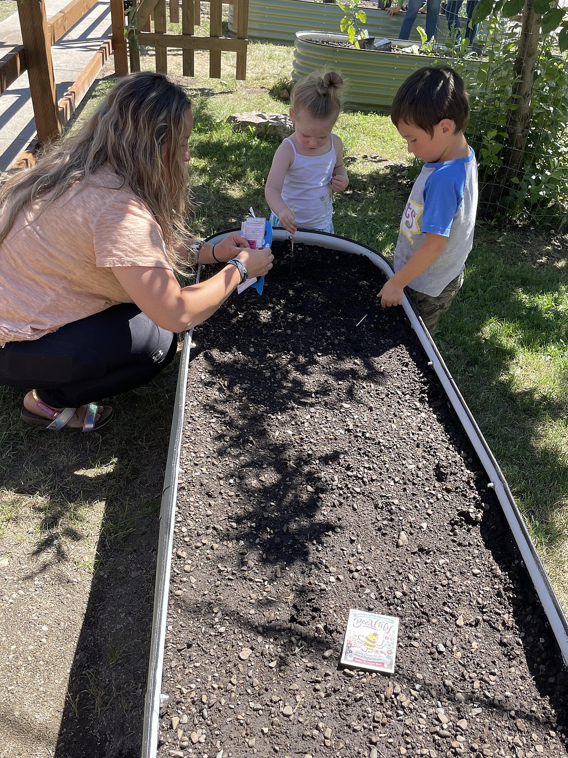 Residents get their hands dirty at the new community garden in Newport.