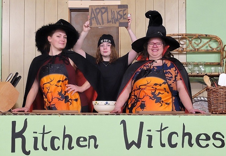 Caitlin Studevant as Isobel Lomax and Heather Smith as Dolly Biddle in Eureka Community Players' production of "Kitchen Witches." Behind them is stage hand Robyn played by Kerah Roose.