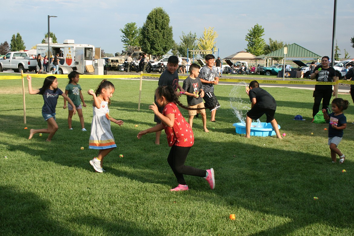A game that involved a lot of water attracted plenty of kids at National Night Out in Quincy.