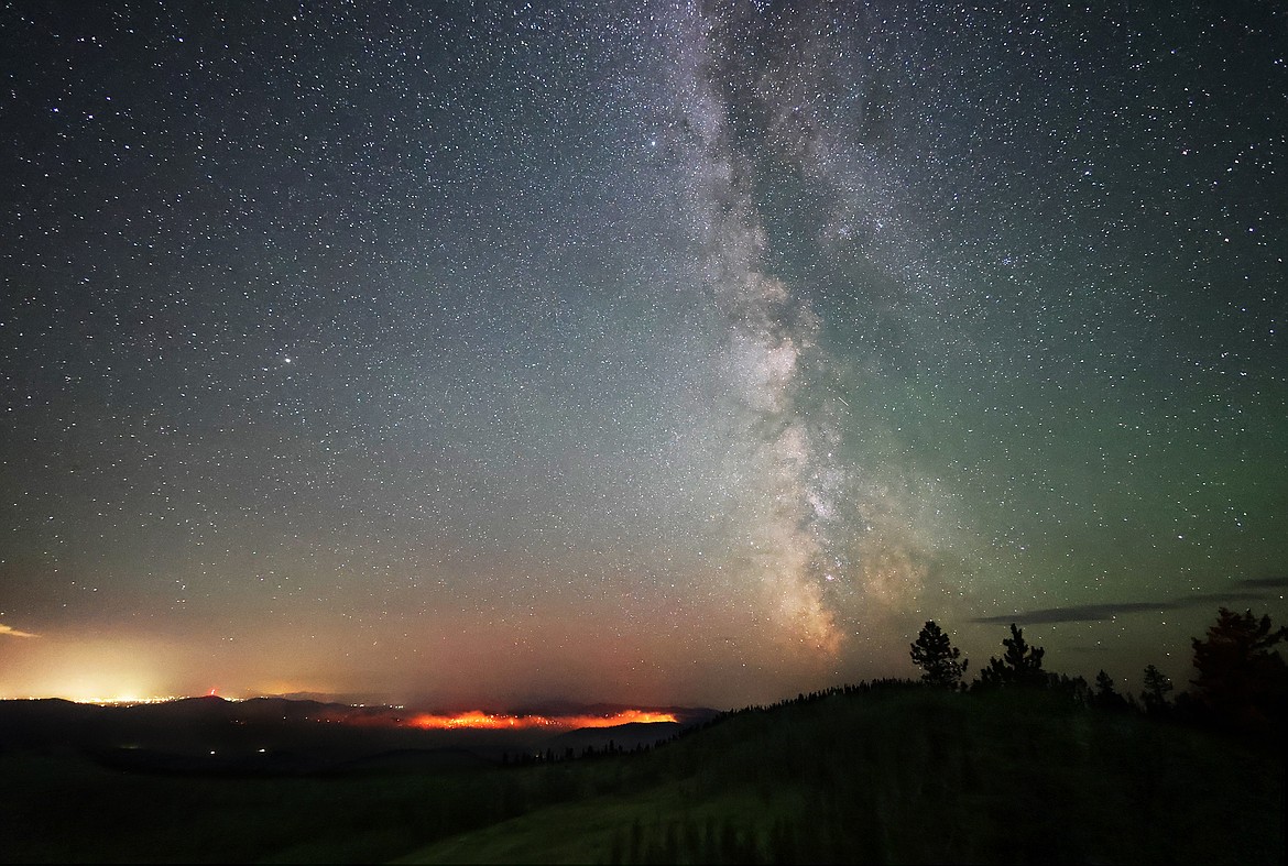 The Milky Way rises above the Elmo 2 Fire early Wednesday Morning, Aug. 3. (Jeremy Weber/Daily Inter Lake)