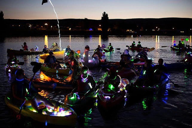 Kayaks, canoes and stand-up paddleboards are decorated with glow-in-the-dark lights to illuminate on Soap Lake after nightfall.