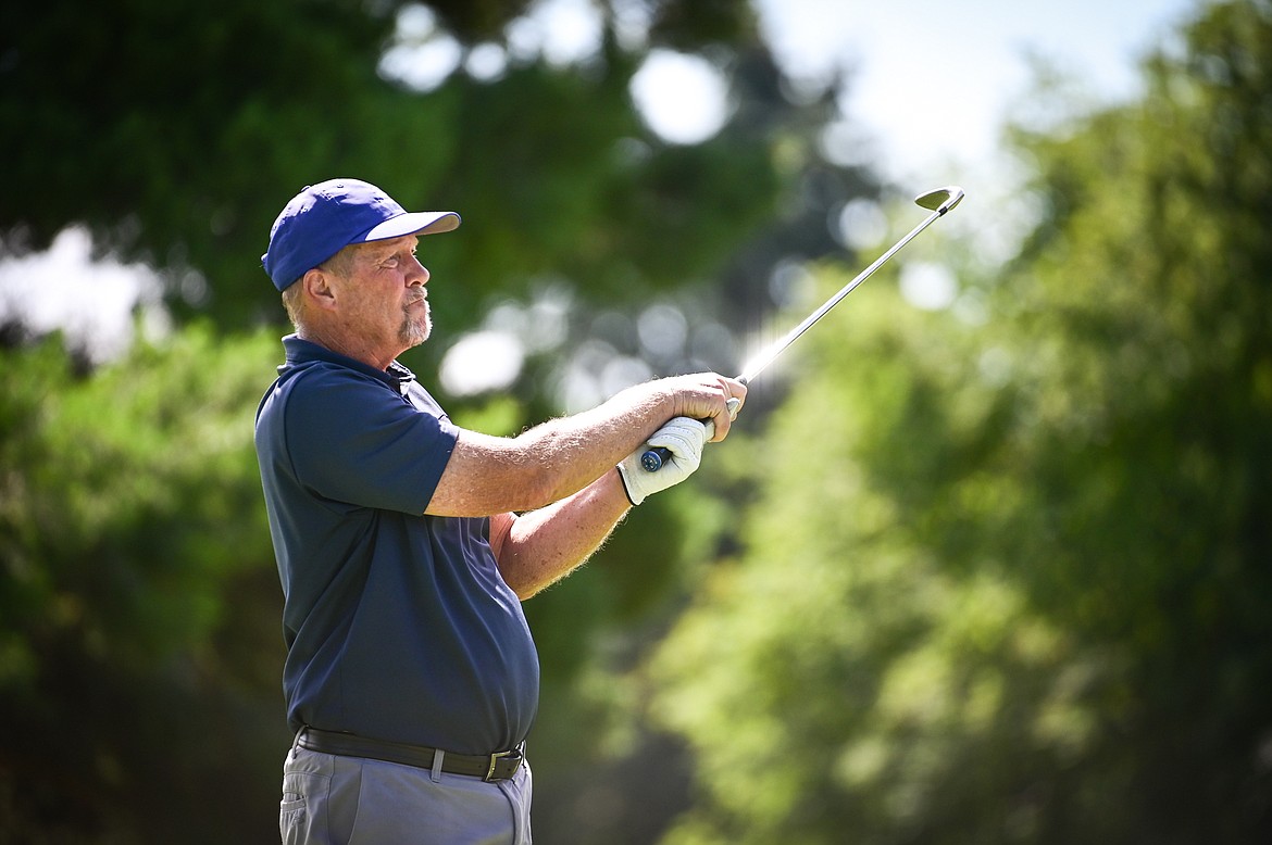 Jeff Niesen watches his tee shot on the 12th hole during the Montana State Senior Golf Tournament at Buffalo Hill Golf Club on Thursday, Aug. 4. (Casey Kreider/Daily Inter Lake)