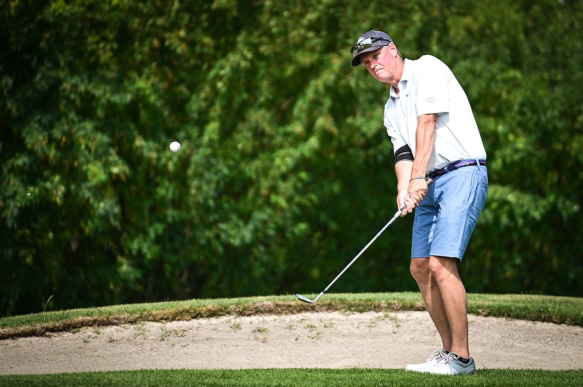 Bill Dunn chips onto the 11th green during the Montana State Senior Golf Tournament at Buffalo Hill Golf Club on Thursday, Aug. 4. (Casey Kreider/Daily Inter Lake)