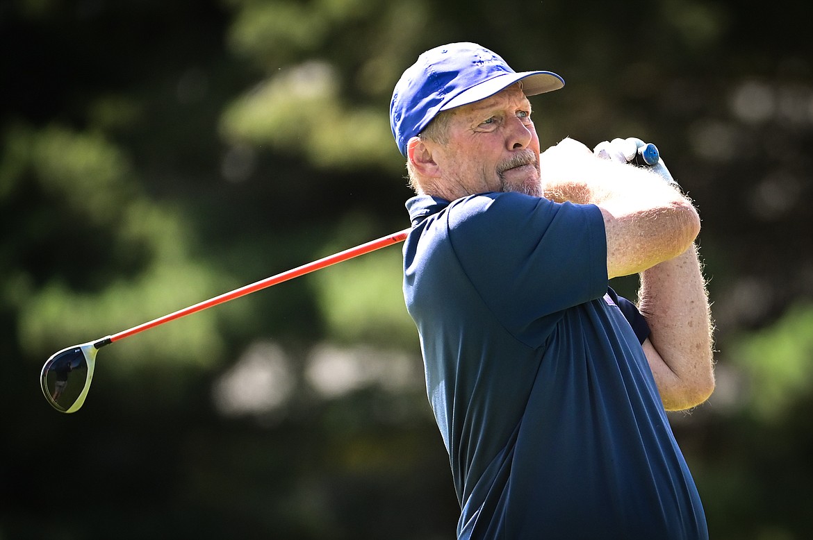 Jeff Niesen watches his drive on the 11th tee during the Montana State Senior Golf Tournament at Buffalo Hill Golf Club on Thursday, Aug. 4. (Casey Kreider/Daily Inter Lake)