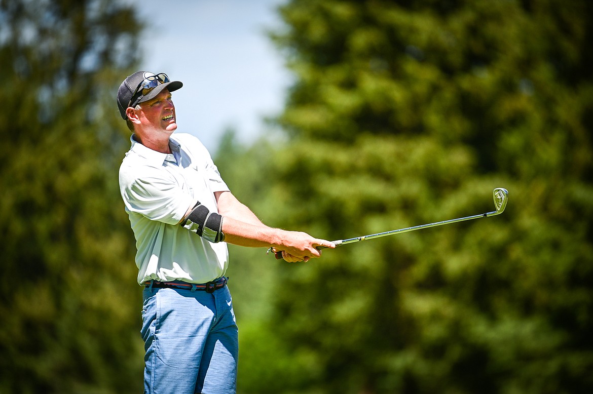 Bill Dunn watches his tee shot on the 16th hole during the Montana State Senior Golf Tournament at Buffalo Hill Golf Club on Thursday, Aug. 4. (Casey Kreider/Daily Inter Lake)