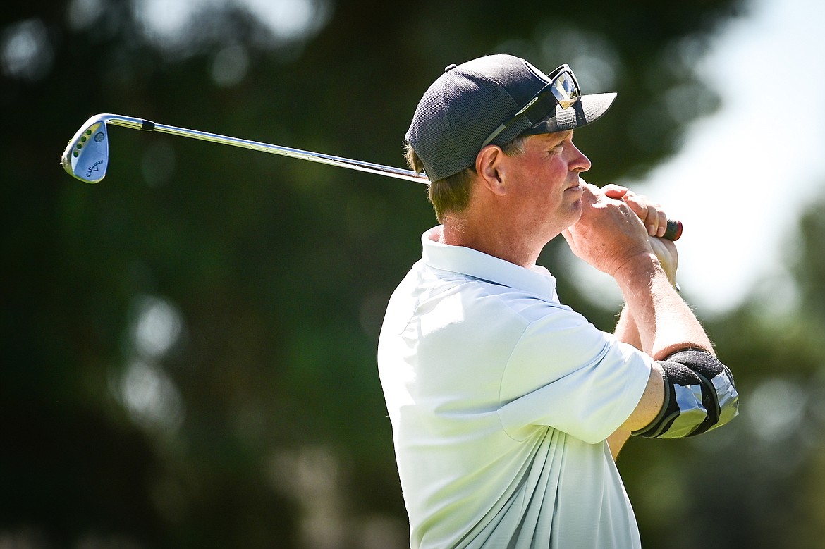 Bill Dunn watches his tee shot on the 12th hole during the Montana State Senior Golf Tournament at Buffalo Hill Golf Club on Thursday, Aug. 4. (Casey Kreider/Daily Inter Lake)