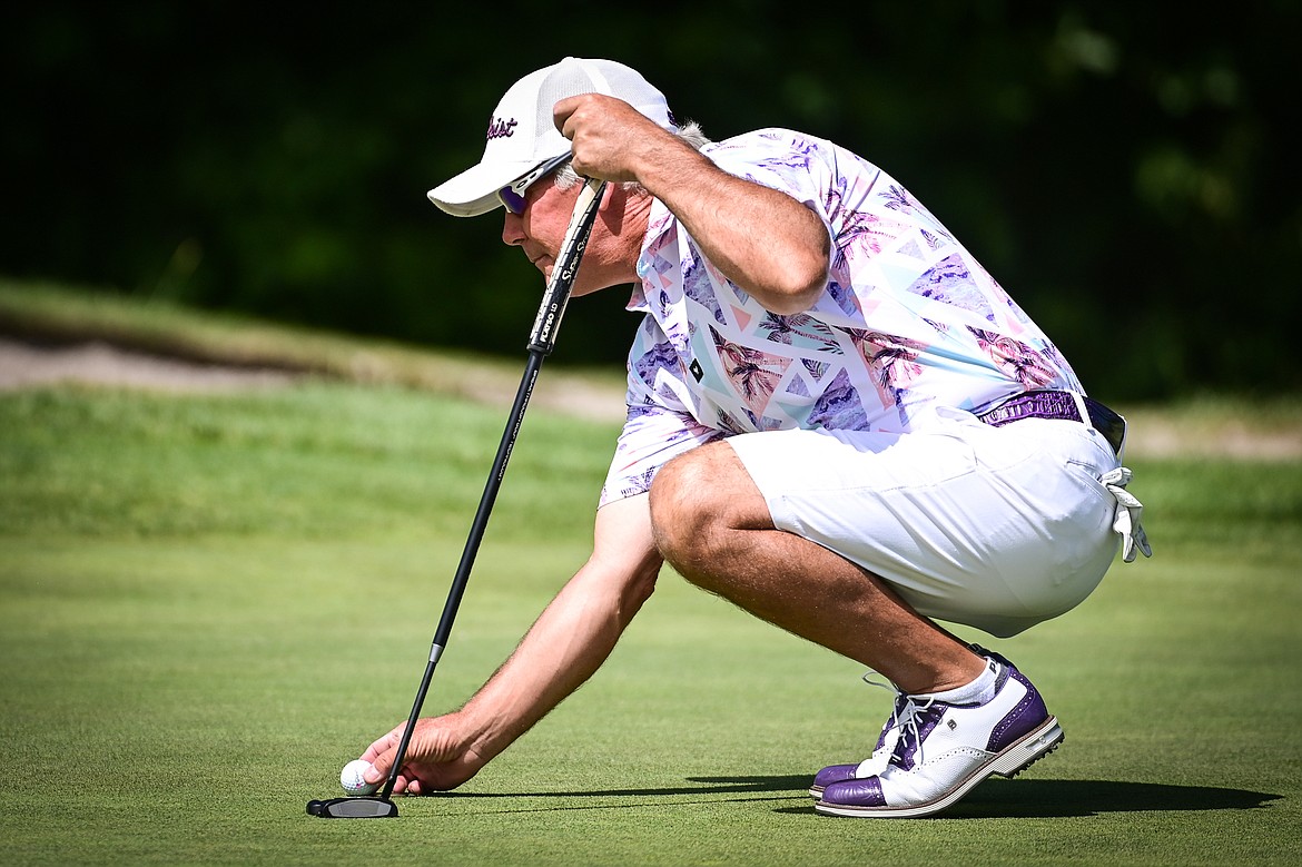 Brad Grattan lines up a putt on the 11th green during the Montana State Senior Golf Tournament at Buffalo Hill Golf Club on Thursday, Aug. 4. (Casey Kreider/Daily Inter Lake)