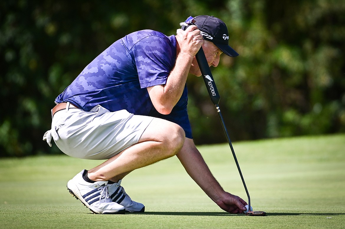 Gene Walsh lines up a putt on the 11th green during the Montana State Senior Golf Tournament at Buffalo Hill Golf Club on Thursday, Aug. 4. (Casey Kreider/Daily Inter Lake)