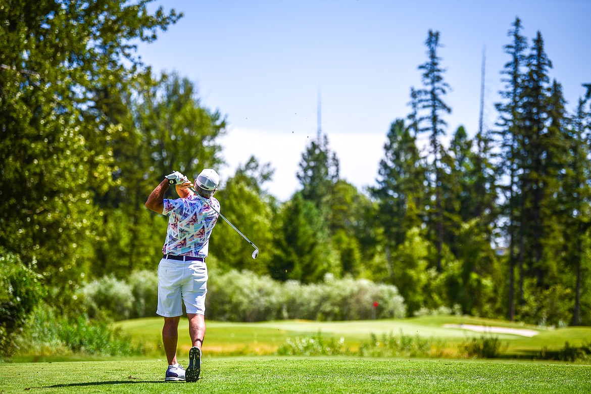 Brad Grattan hits his tee shot on the 16th hole during the Montana State Senior Golf Tournament at Buffalo Hill Golf Club on Thursday, Aug. 4. (Casey Kreider/Daily Inter Lake)