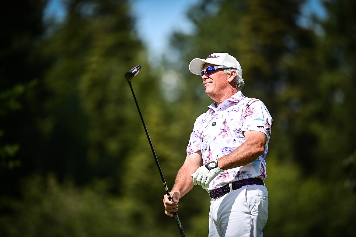 Brad Grattan watches his drive on the 13th tee during the Montana State Senior Golf Tournament at Buffalo Hill Golf Club on Thursday, Aug. 4. (Casey Kreider/Daily Inter Lake)