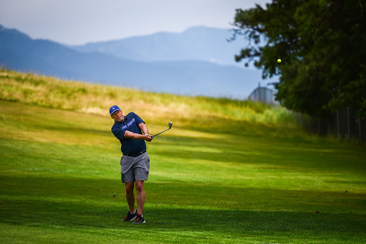 Jeff Niesen hits his approach on the 18th fairway during the Montana State Senior Golf Tournament at Buffalo Hill Golf Club on Thursday, Aug. 4. (Casey Kreider/Daily Inter Lake)