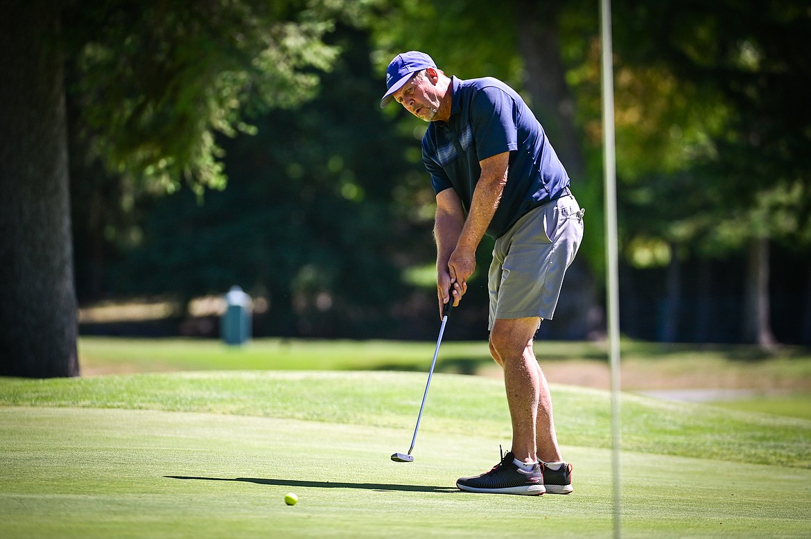 Jeff Niesen sinks a long putt for birdie on the 14th green during the Montana State Senior Golf Tournament at Buffalo Hill Golf Club on Thursday, Aug. 4. (Casey Kreider/Daily Inter Lake)