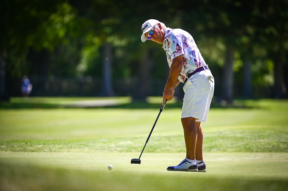 Brad Grattan sinks a long putt for birdie on the 14th green during the Montana State Senior Golf Tournament at Buffalo Hill Golf Club on Thursday, Aug. 4. (Casey Kreider/Daily Inter Lake)