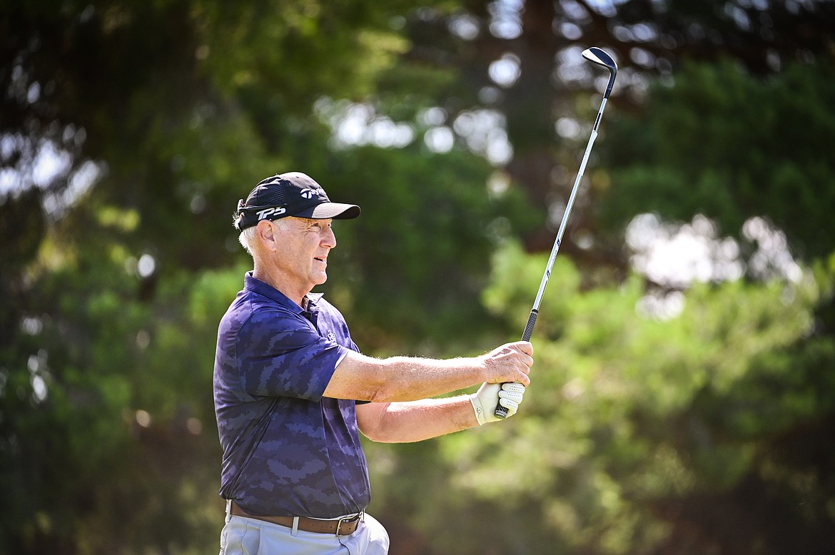 Gene Walsh watches his tee shot on the 12th hole during the Montana State Senior Golf Tournament at Buffalo Hill Golf Club on Thursday, Aug. 4. (Casey Kreider/Daily Inter Lake)