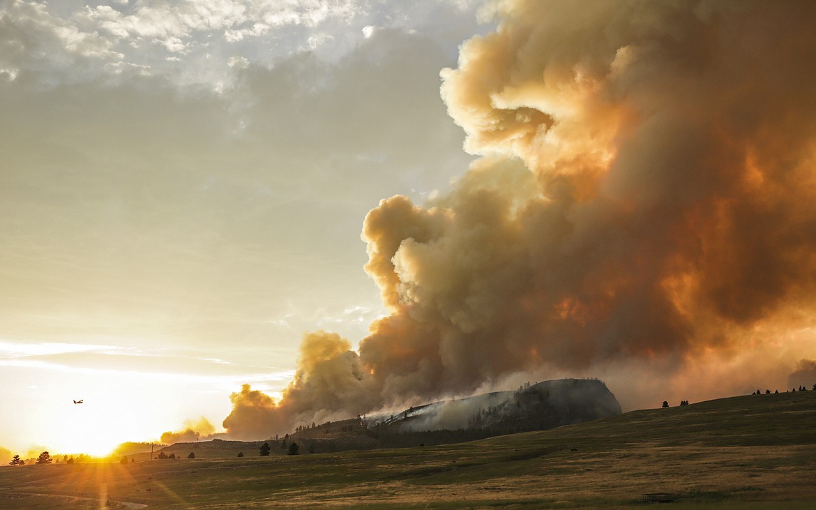 The Elmo Fire burns near Elmo and Dayton, Mont., on the western shore of Flathead Lake on Monday, Aug. 1, 2022. (Hunter D'Antuono/Flathead Beacon via AP)