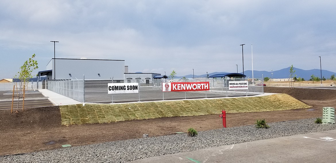 Signs hang from a fence before construction began at the Kenworth Sales site on Expo Parkway in the Expo Urban Renewal District in west Post Falls. The Post Falls Urban Renewal Agency has officially closed the Expo district, which reached the 20-year limitation allowed by Idaho statute.