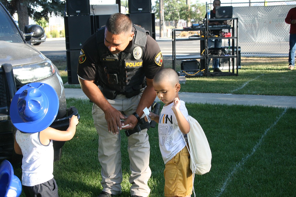 Mattawa Police Department officer Francisco Araiza talks with some of the children at National Night Out.