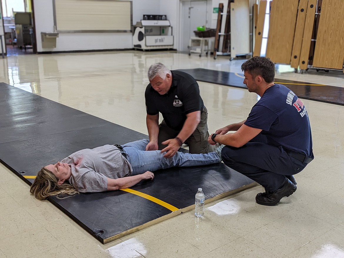 Silverback instructor Don Bird walks Shoshone County Fire District No. 1 Lt. Victor Malsom through the M.A.R.C.H. process to treat a victim.