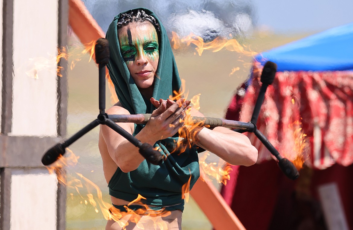 Melissa Coedo shows off her skills during the fire show at the Montana Renaissance Faire at the Majestic Valley Arena Saturday, July 30. (Jeremy Weber/Daily Inter Lake)