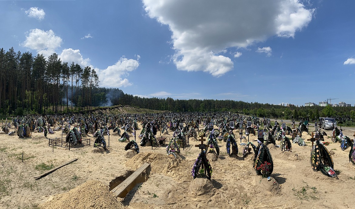 The sun shines on a mass grave in Bucha, near Kyiv, where Jared Malone of Post Falls has helped dozens of people who were traumatized by events that occurred during a Russian occupation of the area early in the ongoing war in Ukraine.