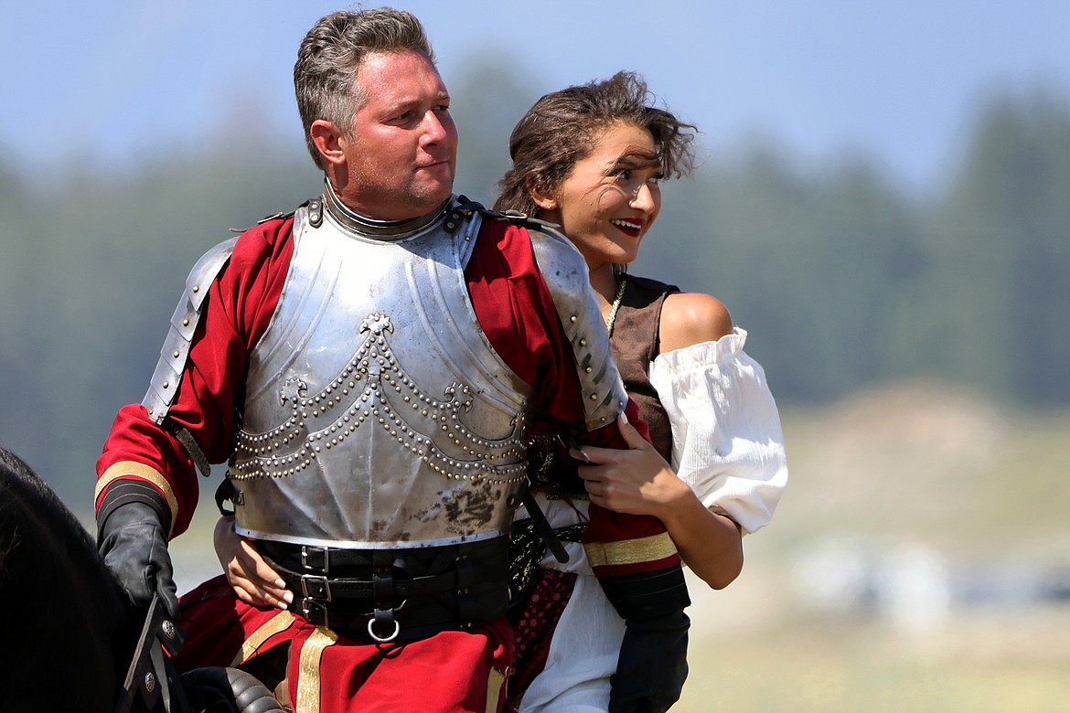 A knight saves his "damsel in distress" at the Montana Renaissance Faire on the grounds of the Majestic Valley Arena Saturday, July 30. (Jeremy Weber/Daily Inter Lake)