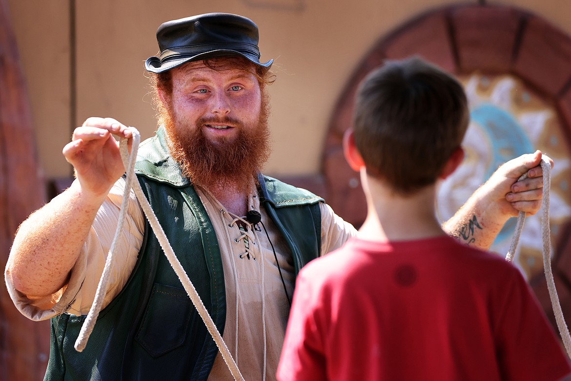 Connor O’Carraig, "The worlds Tallest Leprechaun" delights the crowd with his magic tricks at the Montana Renaissance Faire on the grounds of the Majestic Valley Arena Saturday, July 30. (Jeremy Weber/Daily Inter Lake)