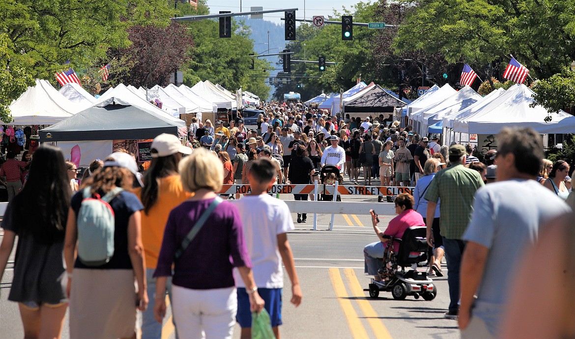 Crowds mill around on Sherman Avenue at the Street Fair on Friday.
