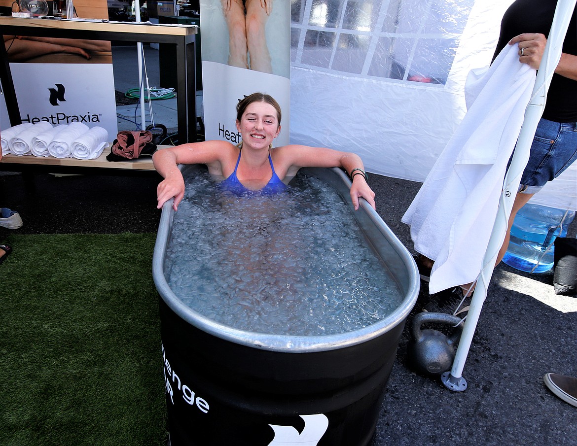 Kylie Francisco tries an ice bath at the Street Fair on Friday.