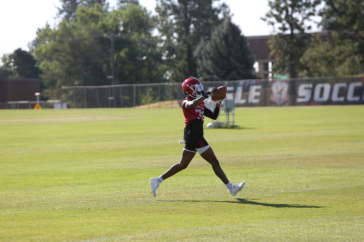 Defensive backs worked on catching over-the-back passes at the beginning of practice on Saturday.