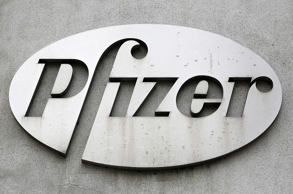 The Pfizer logo is displayed on the exterior of a former Pfizer factory, on May 4, 2014, in the Brooklyn borough of New York. Pfizer is buying sickle cell drug maker Global Blood Therapeutics in an approximately $5.4 billion deal as it looks to accelerate growth after its revenue soared during the pandemic. Both companies' boards have approved the deal, which still needs regulatory approval and approval from GBT shareholders. (AP Photo/Mark Lennihan, File)