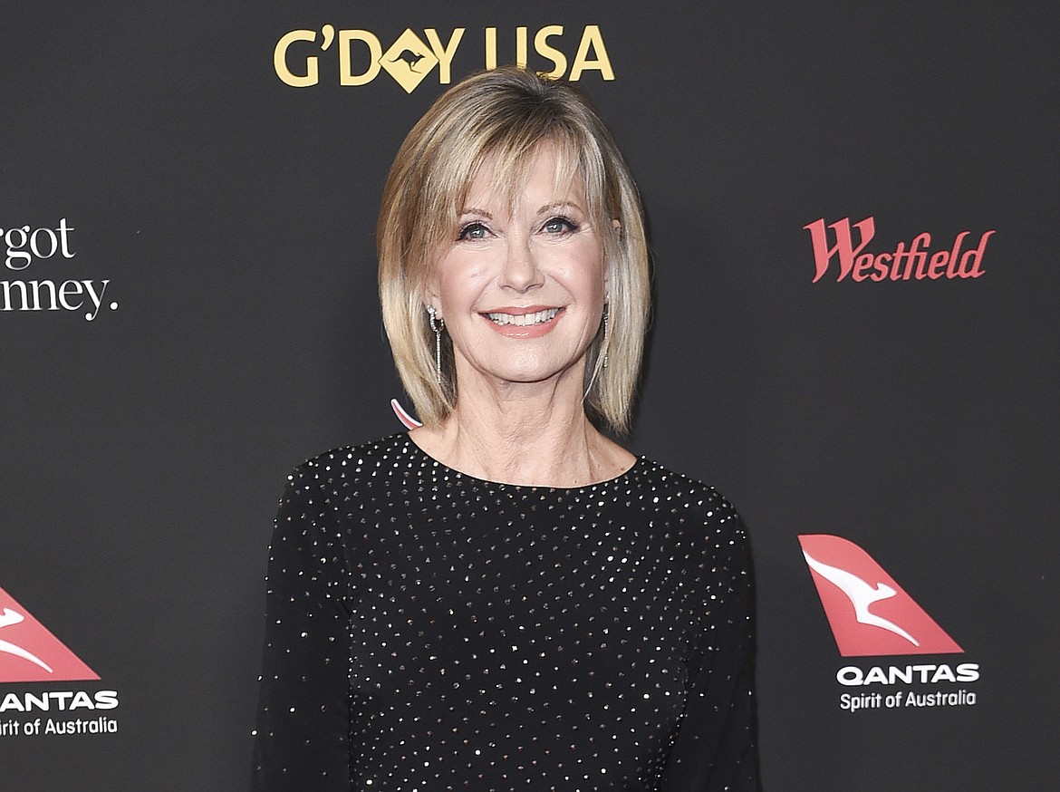 Actress and singer Olivia Newton-John attends the 2018 G'Day USA Los Angeles Gala in Los Angeles on Jan. 27, 2018. Newton-John, a longtime resident of Australia whose sales topped 100 million albums, died Monday at her southern California ranch, John Easterling, her husband, wrote on Instagram and Facebook. She was 73. (Photo by Richard Shotwell/Invision/AP, File)
