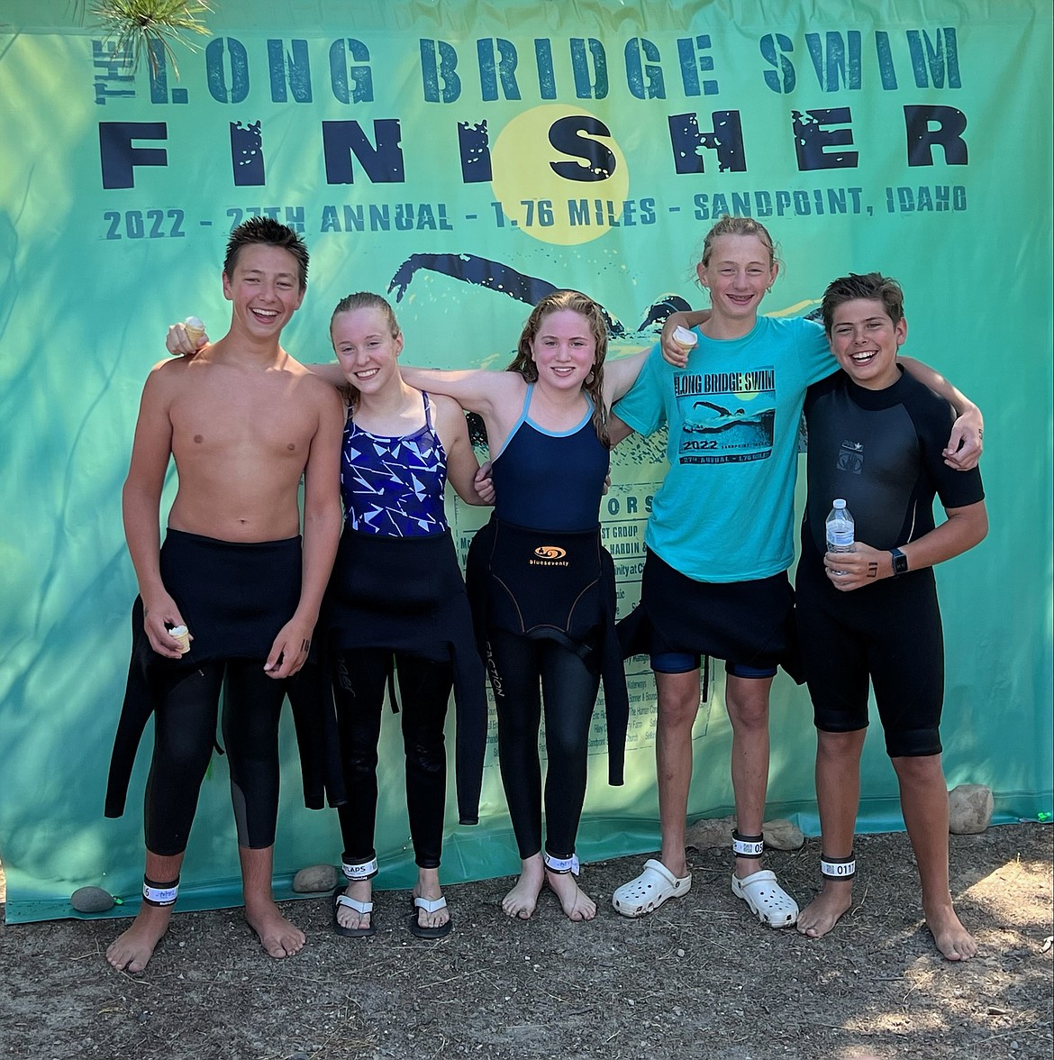 Courtesy photo
Five incoming eighth-graders from the Coeur d'Alene Area Swim team finished the 1.76-mile Long Bridge Swim on Saturday in Sandpoint. The event attracted 530 participants. From left are Dawson Cushman (52 minutes, 3 seconds, 4th in the 10-14 male age group, 50th overall), Addison Wallace (57 minutes, 32 seconds, 6th in the 10-14 female age group, 95th overall), Karsten Towery (57 minutes, 48 seconds, 7th in the 10-14 female age group, 96th overall), Jace Voeller (55 minutes, 1 second, 6th in the 10-14 male age group, 74th overall), and Andrew Davis (51 minutes, 40 seconds, 3rd in the 10-14 male age group, 47th overall). This was their first open-water swim competition. Most will also be swimming the 2.4-mile CDA crossing on Sunday morning from Arrow Point to the Hagadone Event Center and Coeur d'Alene Resort Golf Course.