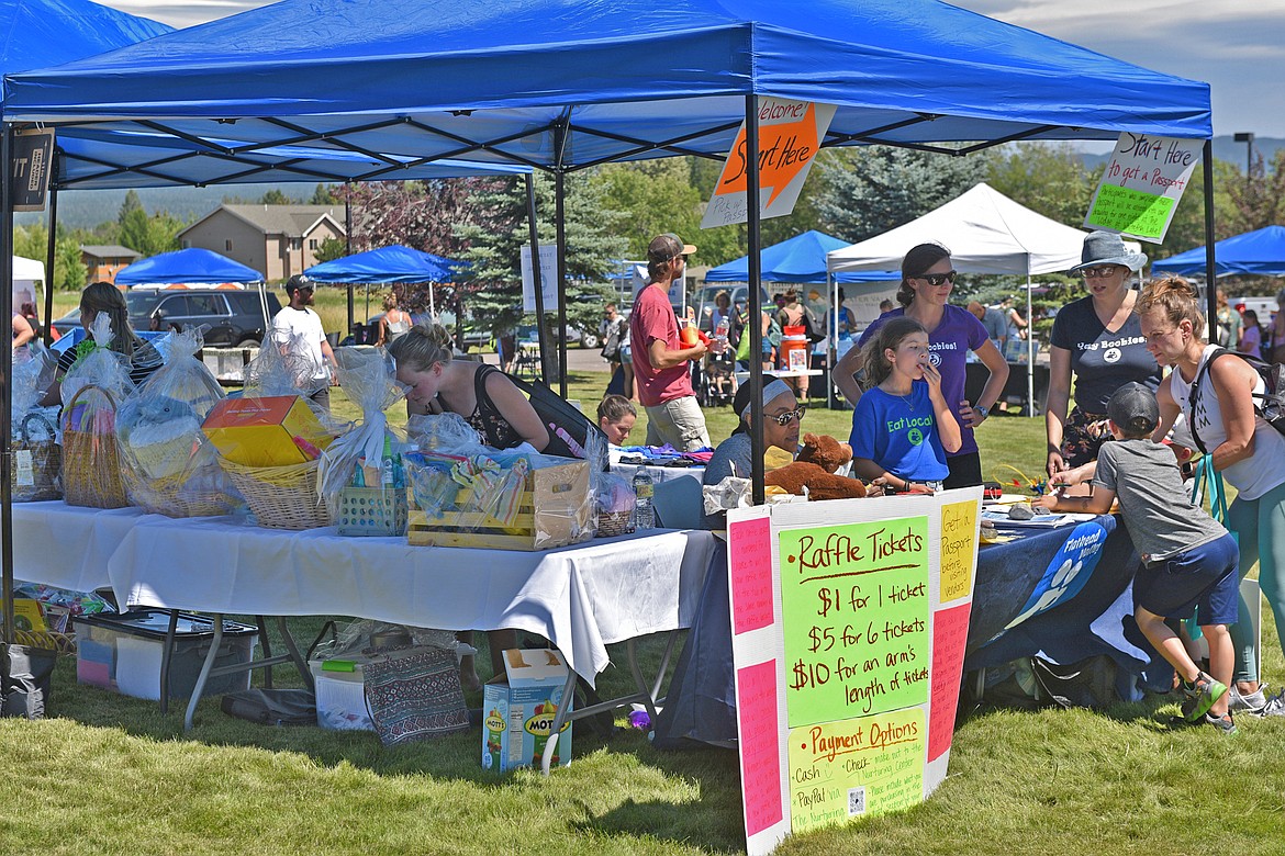 Vendors donated dozens of baskets to be raffled off at the Kids Fair. (Julie Engler/Whitefish Pilot)