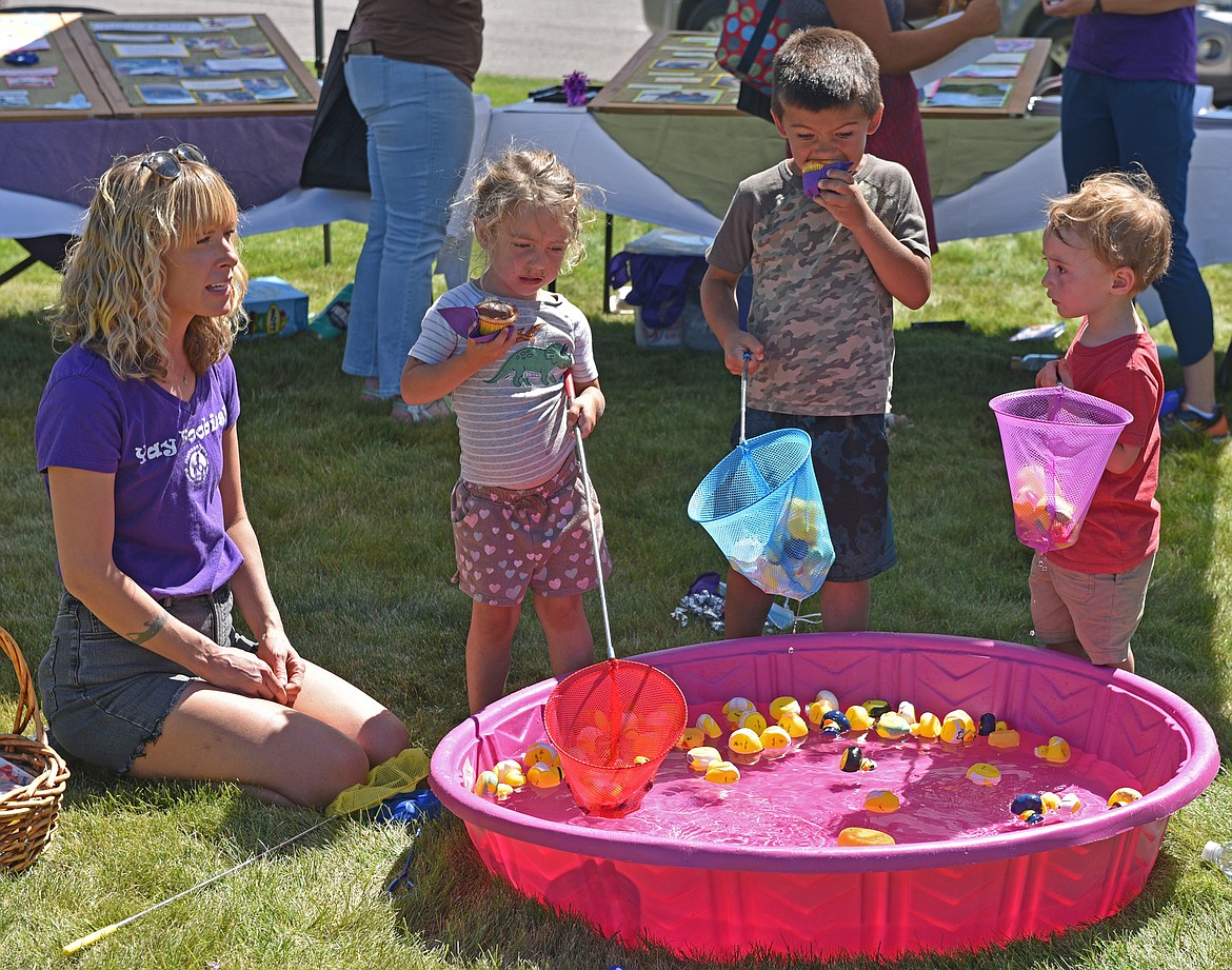 Kids play in the duck pond while enjoying cupcakes during the Kids Fair at Logan Health Whitefish. (Julie Engler/Whitefish Pilot)