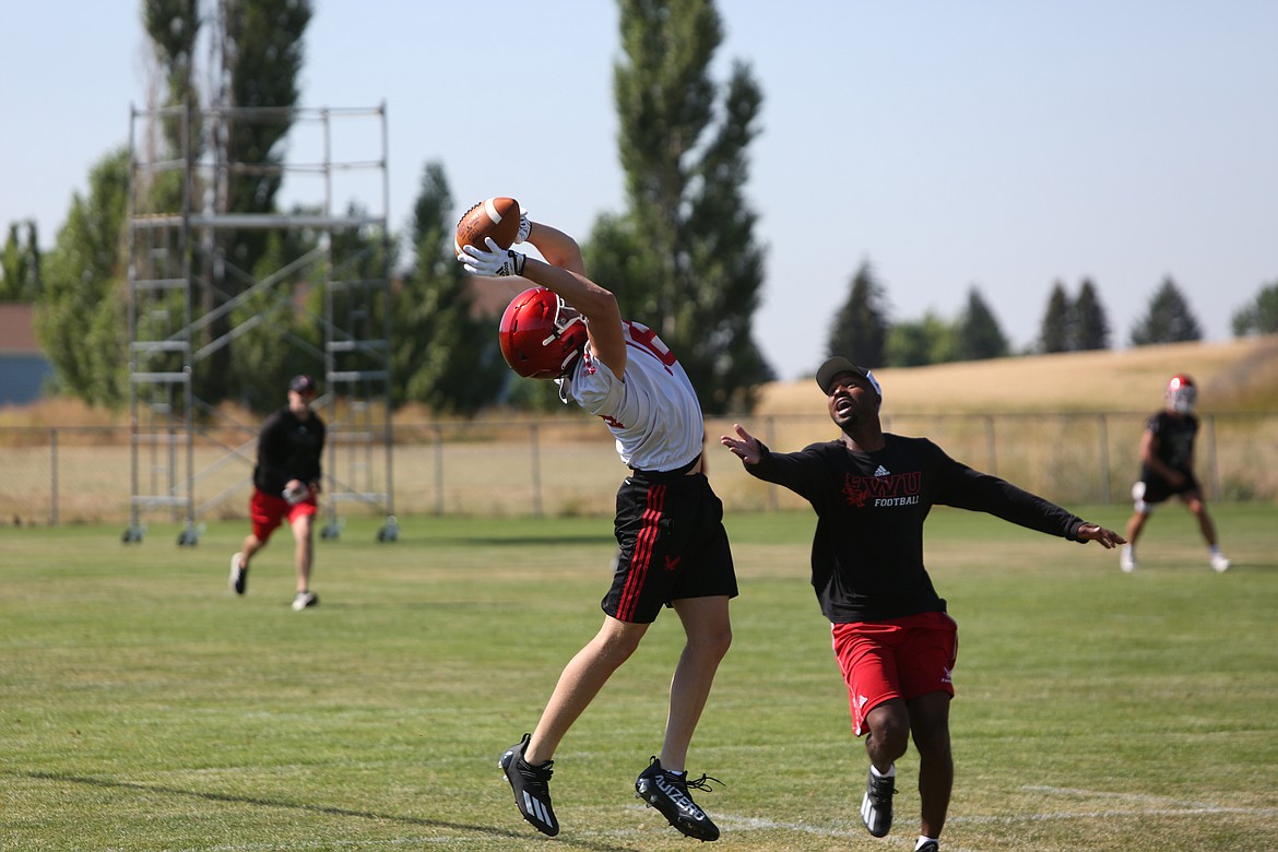 Freshman receiver Miles Williams stretches out for a catch while running a go route.