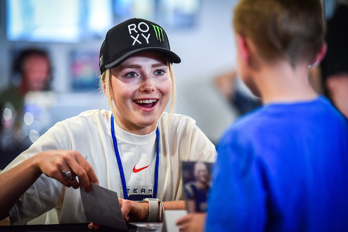 Professional freeskier Maggie Voisin, from Whitefish, signs an autograph at the World Gym Cares Fair on Wednesday, Aug. 10. (Casey Kreider/Daily Inter Lake)