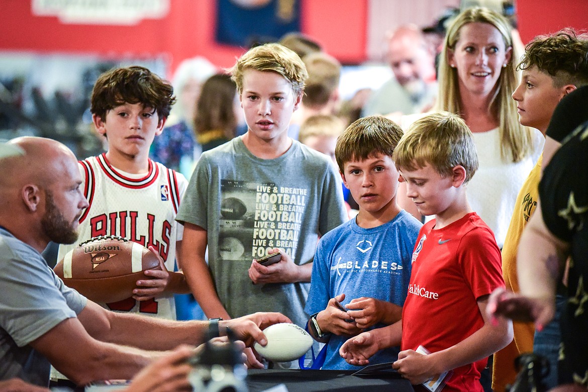 Young fans wait in line for autographs at the World Gym Cares Fair on Wednesday, Aug. 10. (Casey Kreider/Daily Inter Lake)