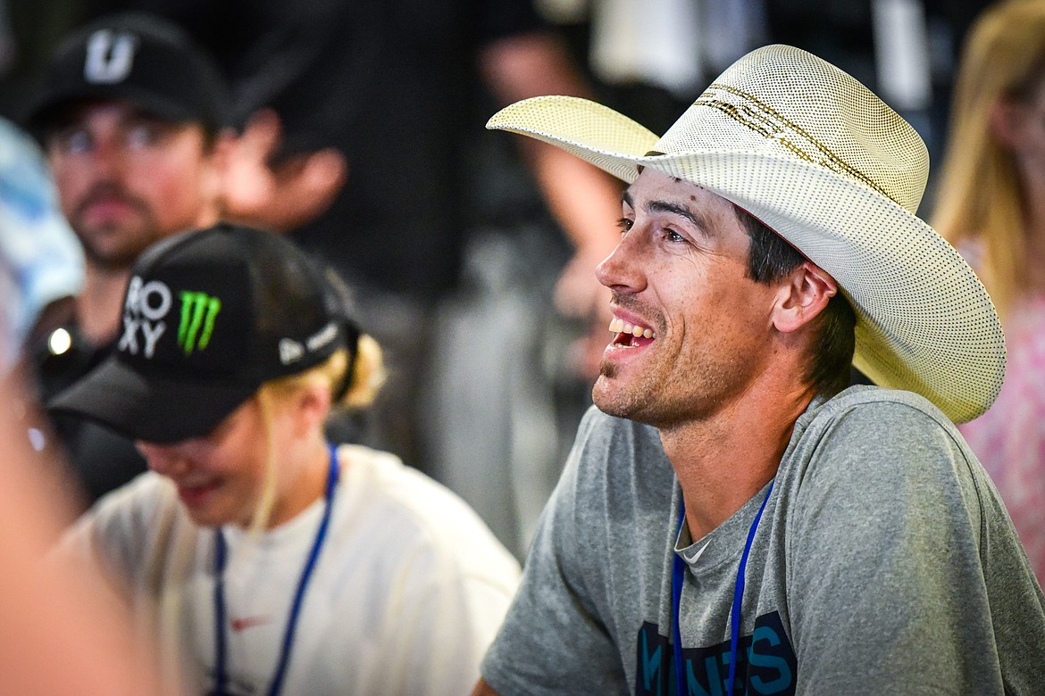Former professional bull rider Beau Hill, from Columbia Falls, signs autographs for fans at the World Gym Cares Fair on Wednesday, Aug. 10. (Casey Kreider/Daily Inter Lake)