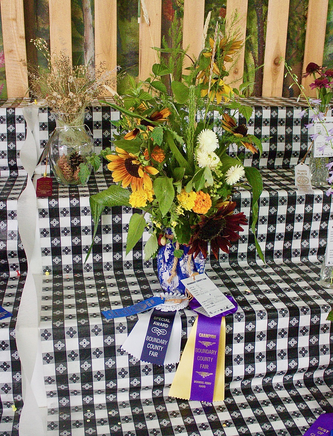 April Coffman's Harvest Themed floral arraignment won, grand champion, special award and a blue ribbon.