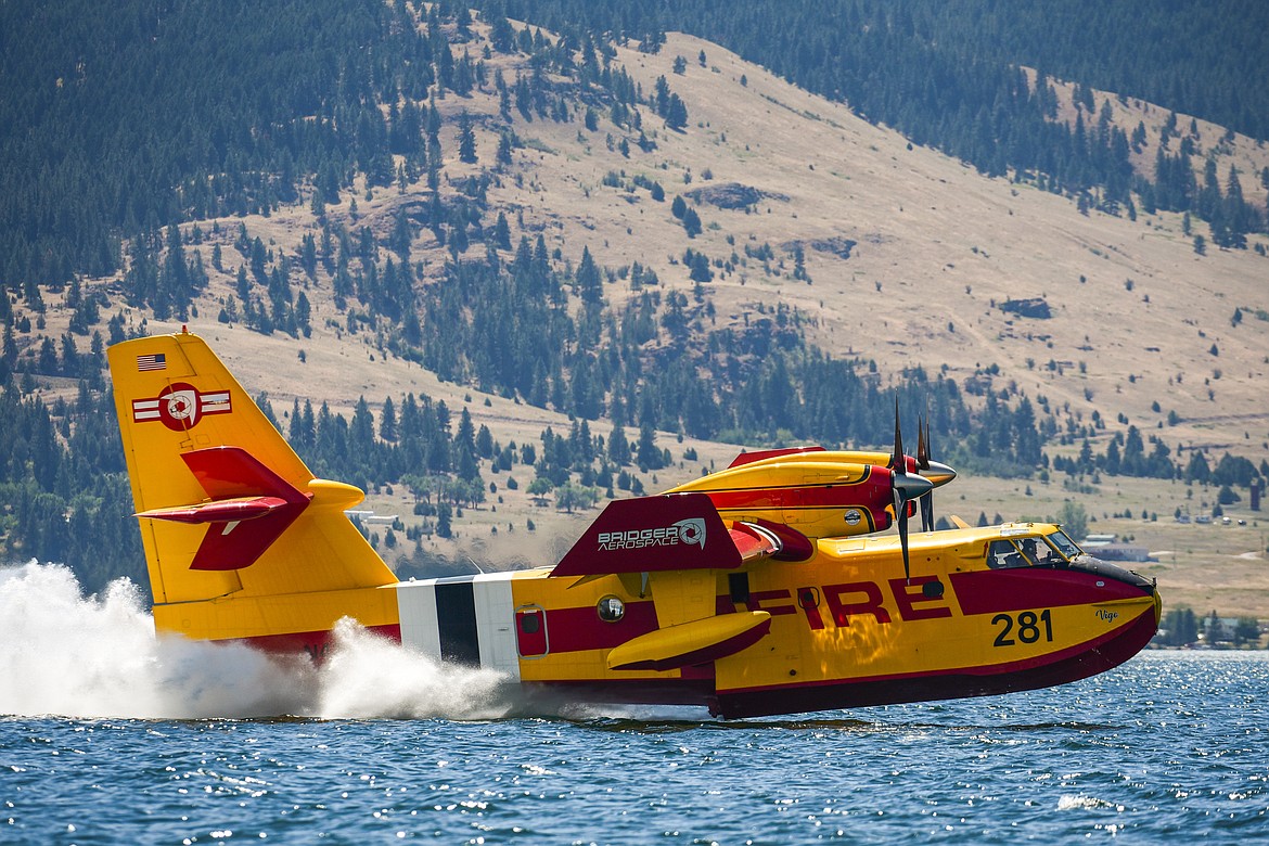 A CL-415EAF super scooper fills up in Flathead Lake near Elmo to fight the Elmo 2 fire on Tuesday, Aug. 2. (Casey Kreider/Daily Inter Lake)