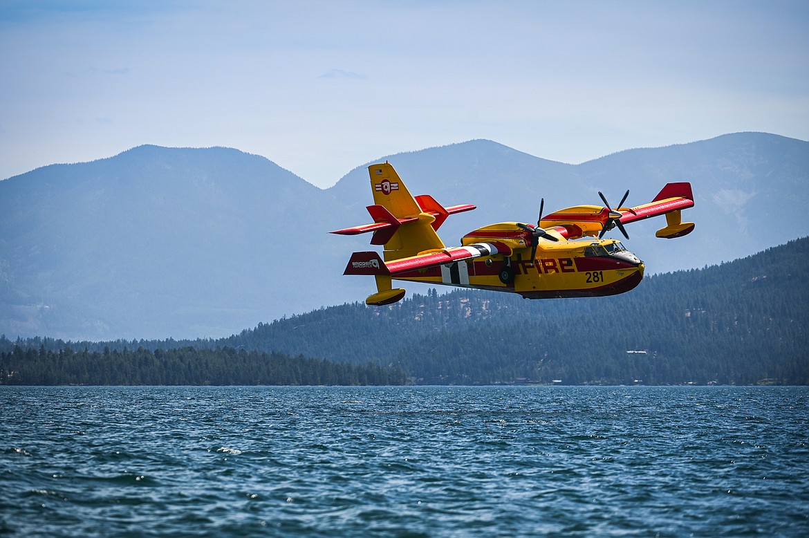 A CL-415EAF super scooper fills up in Flathead Lake near Elmo to fight the Elmo 2 fire on Tuesday, Aug. 2. (Casey Kreider/Daily Inter Lake)