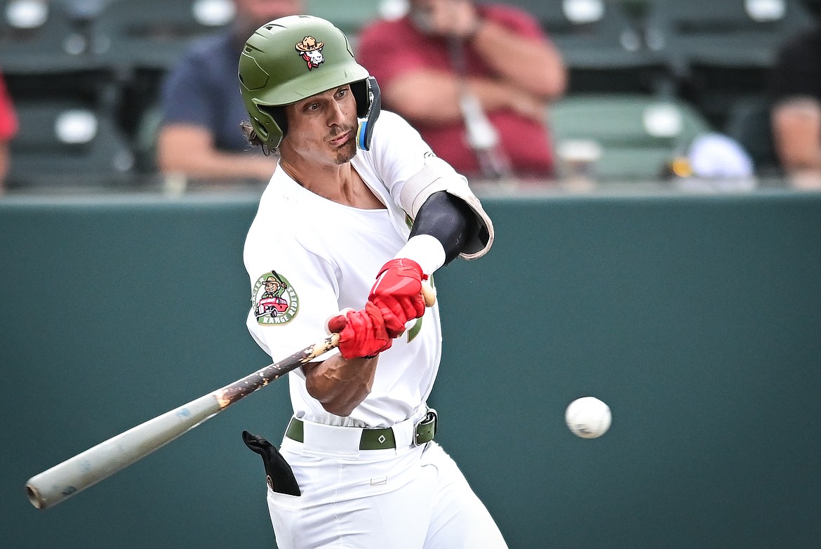 Glacier's Mason Dinesen (9) connects on a single against the Great Falls Voyagers at Flathead Field on Thursday, Aug. 11. (Casey Kreider/Daily Inter Lake)