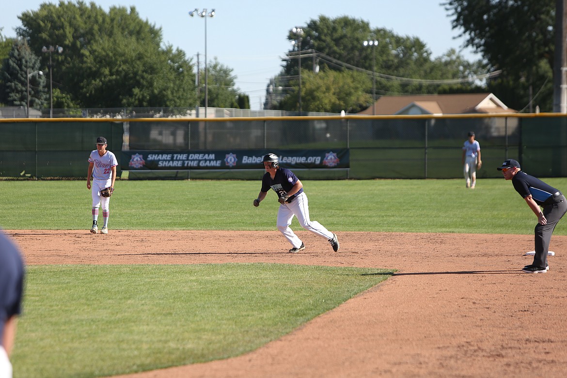 Gavin Burns looks to advance off of second base in the Riverdogs’ loss to the Southeast Tropics. Play will continue into the weekend for the tournament.