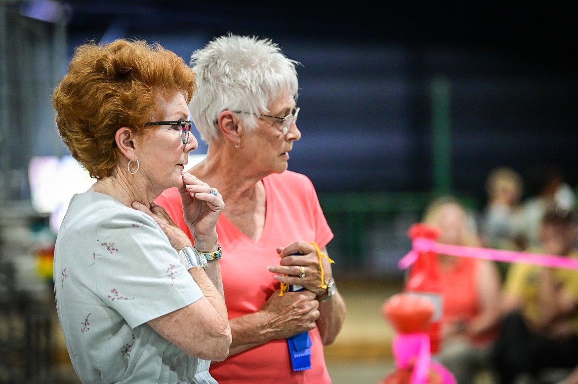 Judge Penny Zorn, left, and ring steward Vicki Olson watch the handlers with their dogs at the 4-H Dog Show at the Northwest Montana Fair on Friday, Aug. 12. (Casey Kreider/Daily Inter Lake)
