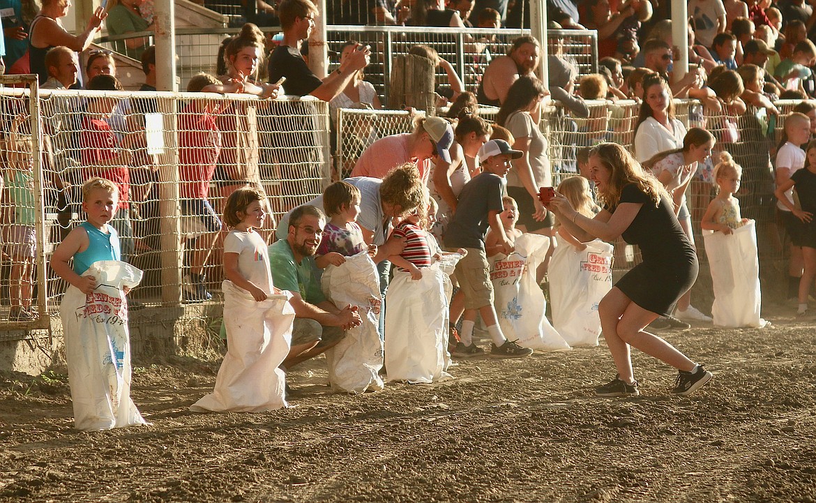Sack race participants ready themselves at 102nd Boundary County Fair during Family Fun Night.